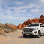 parked white Ford Explorer SUV